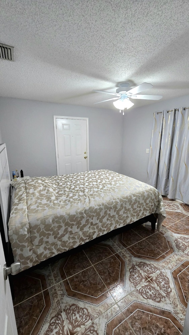 5692 Coconut Rd, West Palm Beach, FL 33413 - bedroom with a textured ceiling and ceiling fan