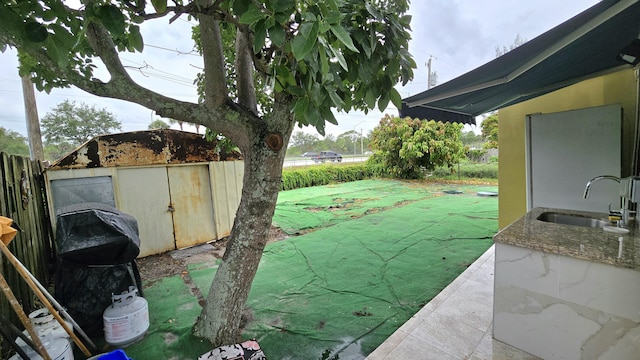 5692 Coconut Rd, West Palm Beach, FL 33413 - fenced backyard featuring a sink