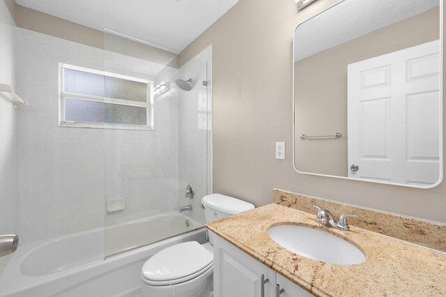 924 SW Abingdon Ave, Port Saint Lucie, FL 34953 - bathroom featuring toilet, vanity, and shower / washtub combination