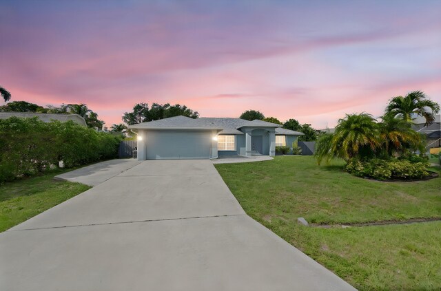 924 SW Abingdon Ave, Port Saint Lucie, FL 34953 - ranch-style home featuring an attached garage, concrete driveway, and stucco siding
