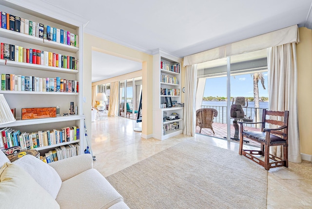 2160 Ibis Isle Rd Unit 9, Palm Beach, FL 33480 - living area featuring built in shelves, a water view, and baseboards