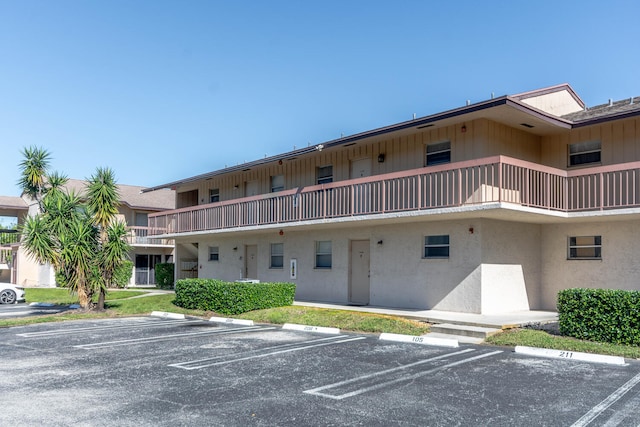 2755 W Atlantic Ave Unit 2208, Delray Beach, FL 33445 - view of building exterior featuring uncovered parking
