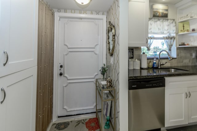 2755 W Atlantic Ave Unit 2208, Delray Beach, FL 33445 - kitchen with stainless steel dishwasher, a sink, white cabinets, and backsplash