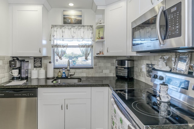 2755 W Atlantic Ave Unit 2208, Delray Beach, FL 33445 - kitchen with stainless steel appliances, a sink, white cabinetry, tasteful backsplash, and open shelves
