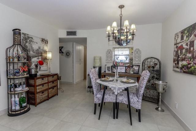 2755 W Atlantic Ave Unit 2208, Delray Beach, FL 33445 - tiled dining room featuring a chandelier and baseboards