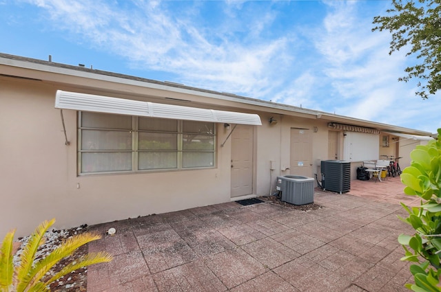1250 Club Dr W Unit C, Delray Beach, FL 33445 - view of patio featuring central air condition unit