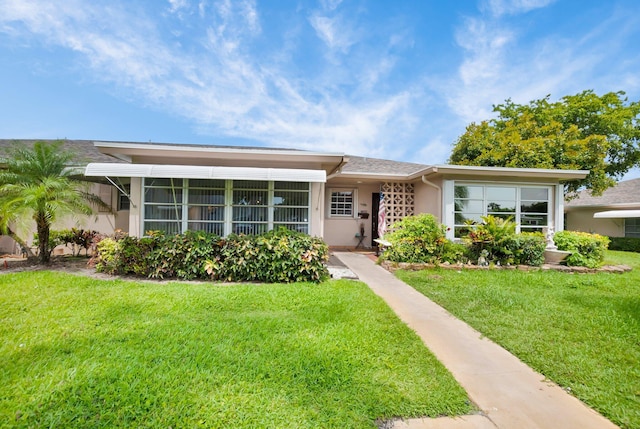 1250 Club Dr W Unit C, Delray Beach, FL 33445 - view of front facade featuring a front lawn and stucco siding