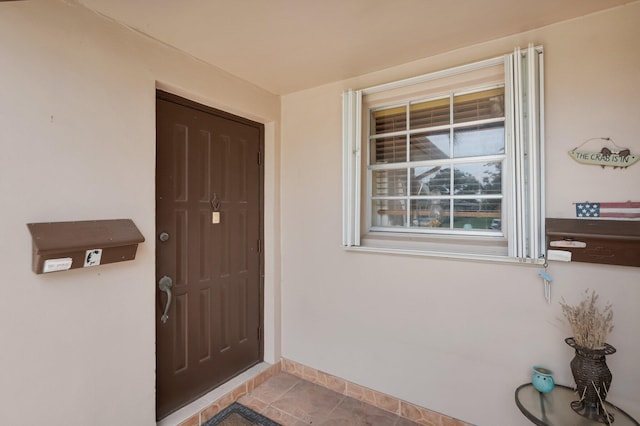 1250 Club Dr W Unit C, Delray Beach, FL 33445 - doorway to property featuring stucco siding and covered porch