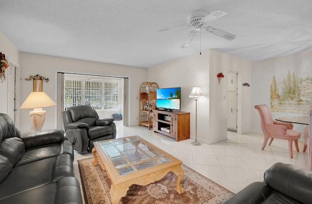 1250 Club Dr W Unit C, Delray Beach, FL 33445 - living area featuring a ceiling fan, light tile patterned floors, a textured ceiling, and baseboards