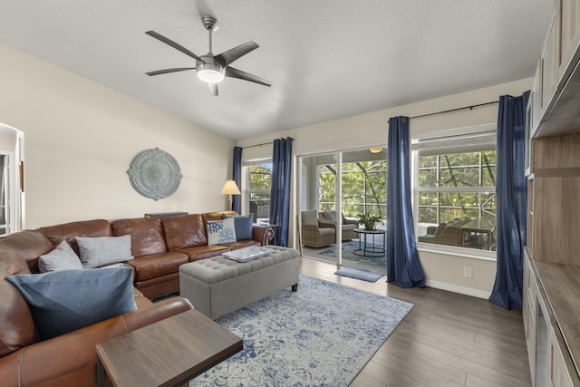 4312 SW Elaine Ct, Port Saint Lucie, FL 34953 - living room with a ceiling fan, wood finished floors, baseboards, and a textured ceiling