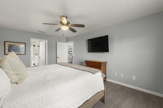 4312 SW Elaine Ct, Port Saint Lucie, FL 34953 - bedroom featuring dark wood finished floors, baseboards, ceiling fan, and ensuite bath