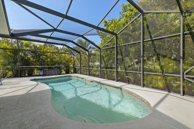 4312 SW Elaine Ct, Port Saint Lucie, FL 34953 - swimming pool featuring a patio area and glass enclosure