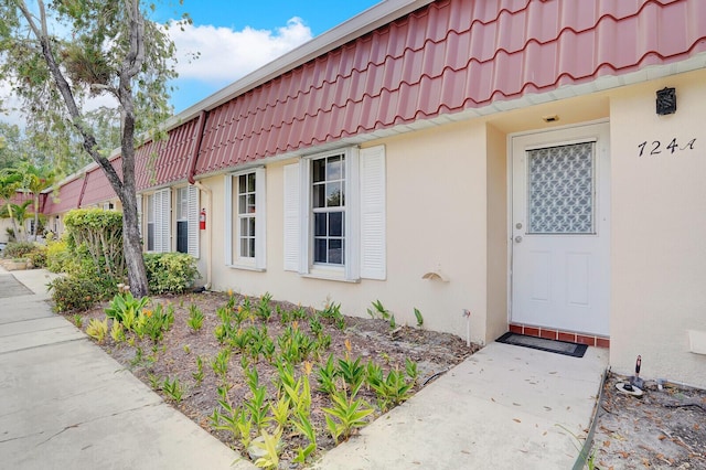 724 Nantucket Cir Unit A, Lake Worth, FL 33467 - property entrance featuring a tile roof and stucco siding
