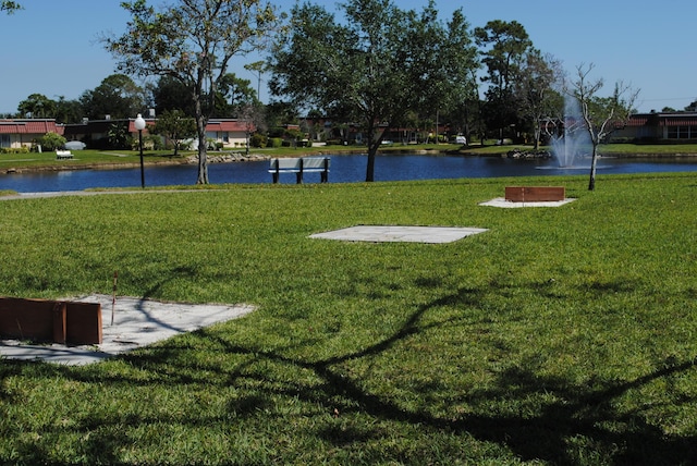 724 Nantucket Cir Unit A, Lake Worth, FL 33467 - view of home's community with a water view and a lawn