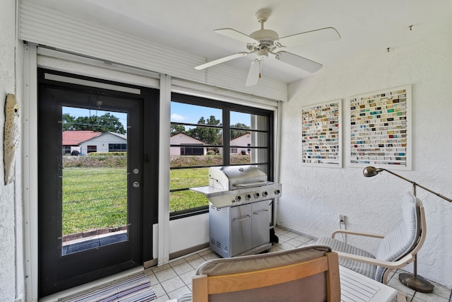 4858 Equestrian Rd Unit B, Boynton Beach, FL 33436 - doorway with a textured wall, light tile patterned flooring, and ceiling fan