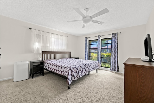 4858 Equestrian Rd Unit B, Boynton Beach, FL 33436 - carpeted bedroom with multiple windows, a textured ceiling, baseboards, and ceiling fan