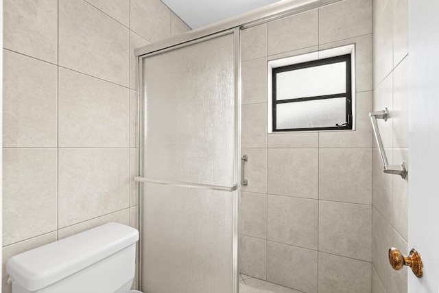 4858 Equestrian Rd Unit B, Boynton Beach, FL 33436 - full bathroom featuring a shower stall, toilet, and tile walls