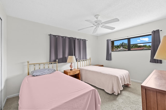 4858 Equestrian Rd Unit B, Boynton Beach, FL 33436 - carpeted bedroom with baseboards, ceiling fan, and a textured ceiling