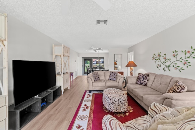 4858 Equestrian Rd Unit B, Boynton Beach, FL 33436 - living room with ceiling fan, light wood-style floors, and a textured ceiling