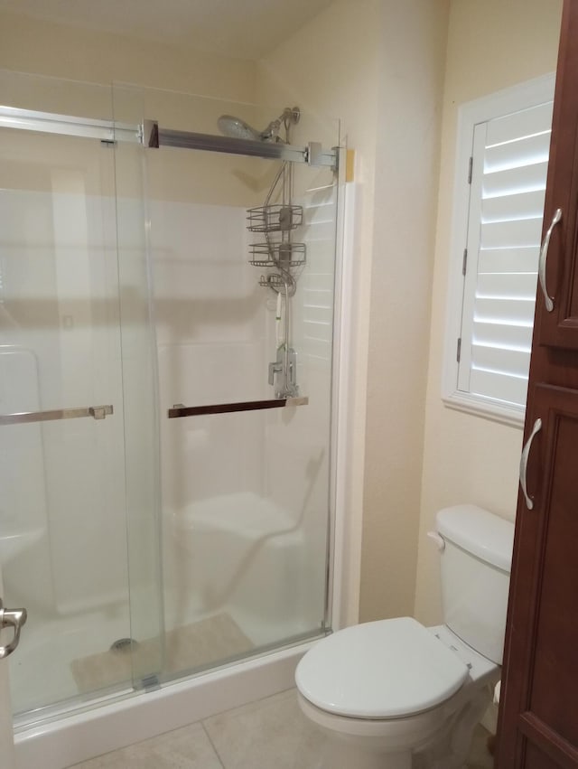 2 Antigua Ln, Port Saint Lucie, FL 34952 - full bathroom featuring toilet, a shower stall, and tile patterned flooring