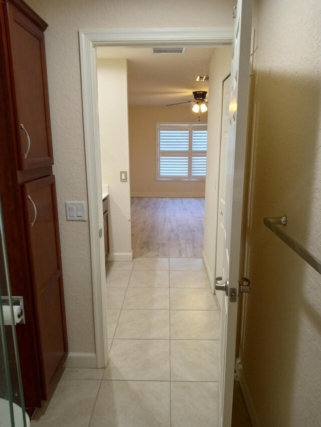 2 Antigua Ln, Port Saint Lucie, FL 34952 - hall featuring light tile patterned flooring and baseboards