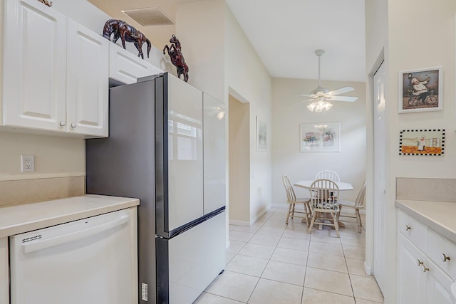 257 NW Toscane Trl, Port Saint Lucie, FL 34986 - kitchen featuring dishwasher, white cabinets, a ceiling fan, light tile patterned flooring, and freestanding refrigerator