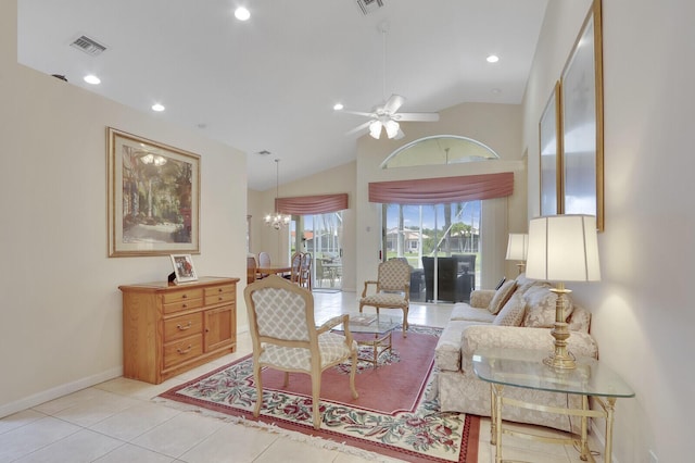 257 NW Toscane Trl, Port Saint Lucie, FL 34986 - living room featuring ceiling fan, baseboards, light tile patterned floors, a chandelier, and high vaulted ceiling