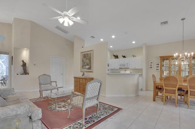 257 NW Toscane Trl, Port Saint Lucie, FL 34986 - living room with light tile patterned floors, a chandelier, ceiling fan, high vaulted ceiling, and baseboards