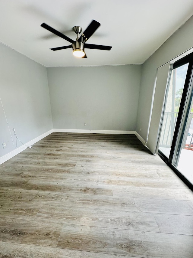 11887 SW 13th Ct, Davie, FL 33325 - unfurnished room with plenty of natural light, wood finished floors, and baseboards