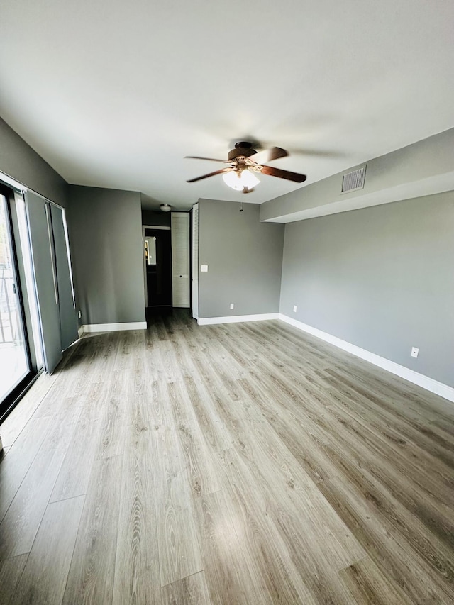 11887 SW 13th Ct, Davie, FL 33325 - unfurnished living room featuring ceiling fan, wood finished floors, and baseboards