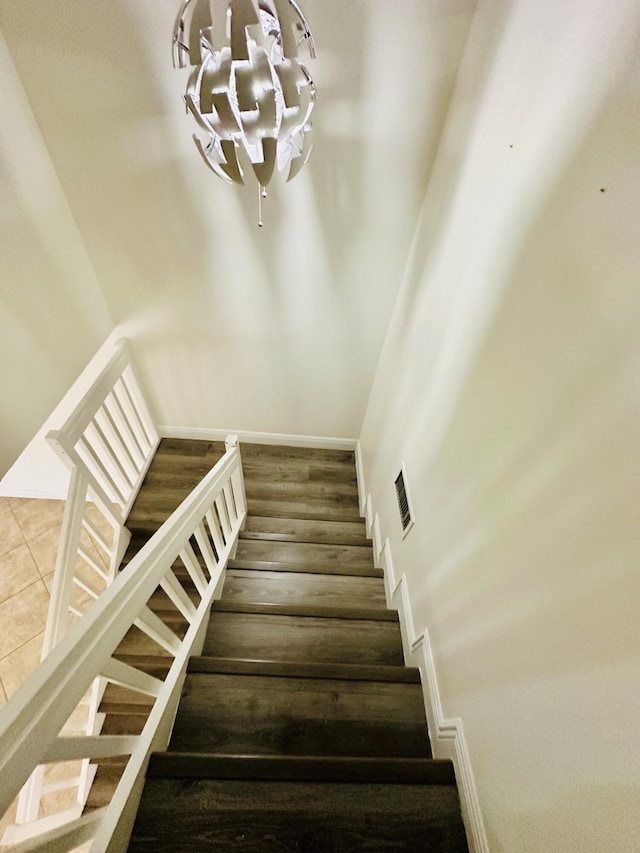 11887 SW 13th Ct, Davie, FL 33325 - stairs featuring a chandelier and baseboards