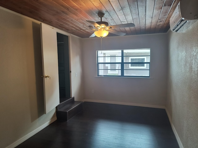 626 Texas Ct, Fort Pierce, FL 34950 - empty room with wood ceiling, a wall mounted AC, a ceiling fan, hardwood / wood-style flooring, and baseboards