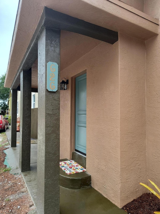 626 Texas Ct, Fort Pierce, FL 34950 - property entrance featuring stucco siding