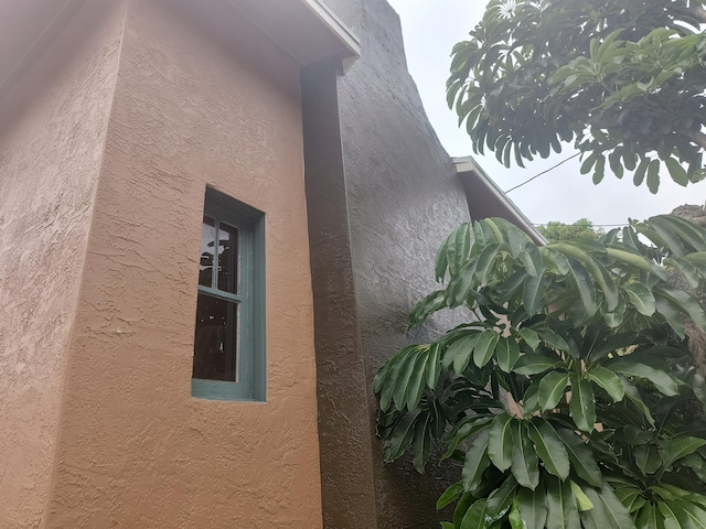 626 Texas Ct, Fort Pierce, FL 34950 - view of side of home featuring stucco siding