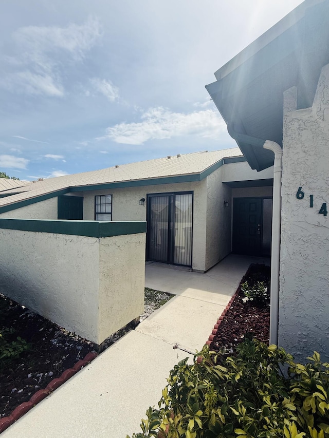 614 SW Jeanne St, Port Saint Lucie, FL 34953 - back of property with stucco siding