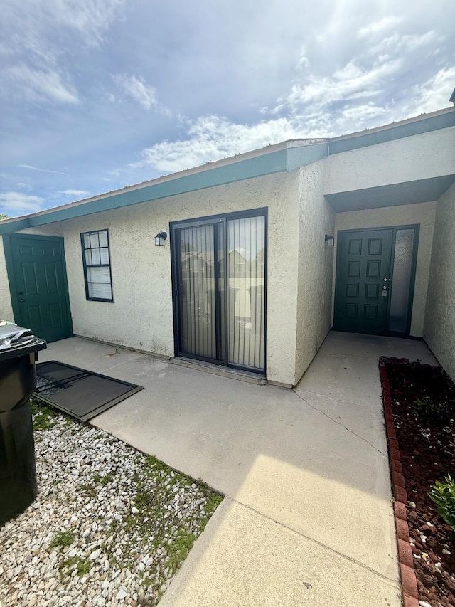 614 SW Jeanne St, Port Saint Lucie, FL 34953 - view of exterior entry with stucco siding