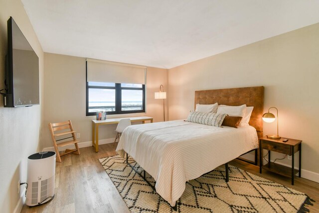 9650 S Ocean Dr Unit 1604, Jensen Beach, FL 34957 - bedroom featuring light wood-type flooring and baseboards