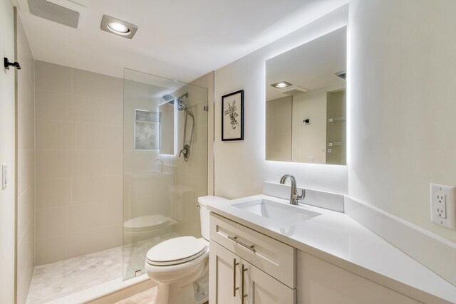 9650 S Ocean Dr Unit 1604, Jensen Beach, FL 34957 - full bath featuring toilet, a walk in shower, vanity, and recessed lighting