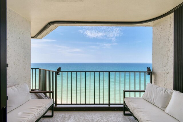 9650 S Ocean Dr Unit 1604, Jensen Beach, FL 34957 - balcony featuring a water view and outdoor lounge area
