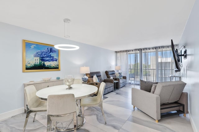 12 Royal Palm Way Unit 605, Boca Raton, FL 33432 - dining area featuring baseboards