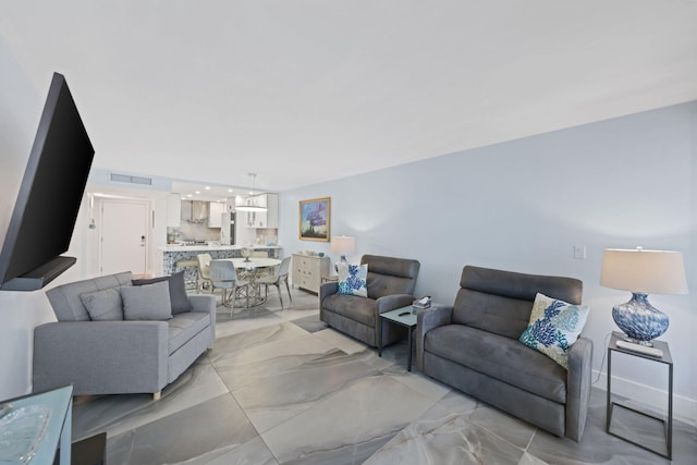 12 Royal Palm Way Unit 605, Boca Raton, FL 33432 - living area featuring light marble finish flooring and a chandelier