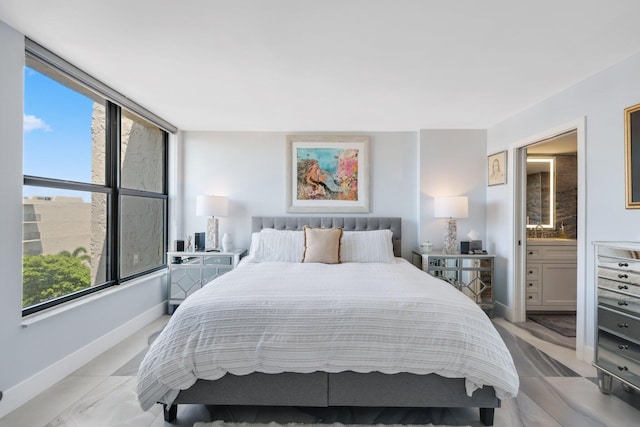 12 Royal Palm Way Unit 605, Boca Raton, FL 33432 - bedroom with baseboards and ensuite bath
