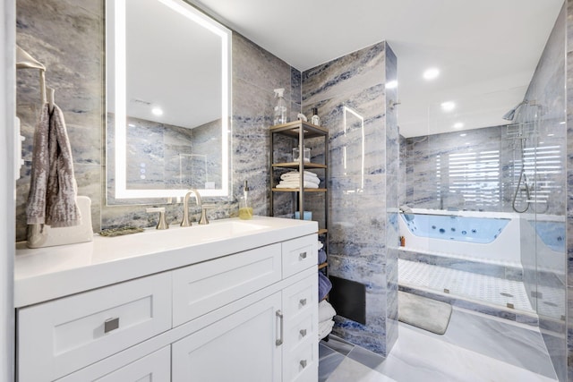 12 Royal Palm Way Unit 605, Boca Raton, FL 33432 - bathroom featuring a walk in shower, vanity, and tile walls