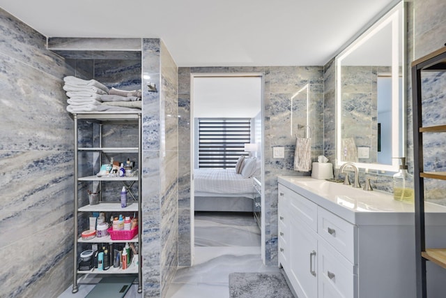 12 Royal Palm Way Unit 605, Boca Raton, FL 33432 - ensuite bathroom featuring vanity and marble finish flooring