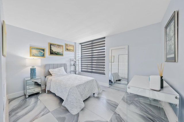 12 Royal Palm Way Unit 605, Boca Raton, FL 33432 - bedroom featuring light marble finish flooring and baseboards