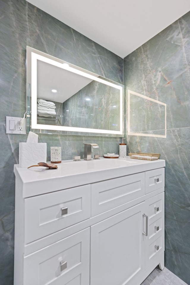 12 Royal Palm Way Unit 605, Boca Raton, FL 33432 - bathroom featuring tile walls and vanity