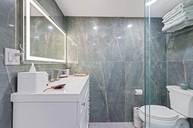 12 Royal Palm Way Unit 605, Boca Raton, FL 33432 - bathroom with tile walls, toilet, and vanity