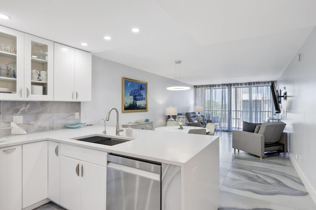 12 Royal Palm Way Unit 605, Boca Raton, FL 33432 - kitchen with a sink, dishwasher, a peninsula, backsplash, and open floor plan