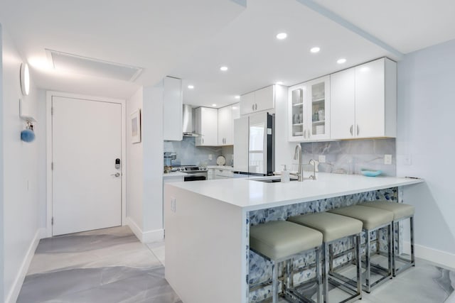 12 Royal Palm Way Unit 605, Boca Raton, FL 33432 - kitchen with stainless steel appliances, a sink, baseboards, tasteful backsplash, and recessed lighting