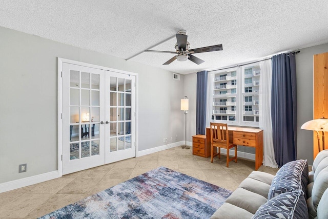 4511 S Ocean Blvd Unit 106, Highland Beach, FL 33487 - living area featuring french doors, a ceiling fan, a textured ceiling, baseboards, and tile patterned floors